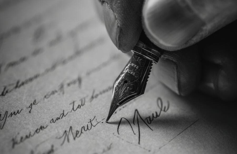 A fountain pen signing a document.